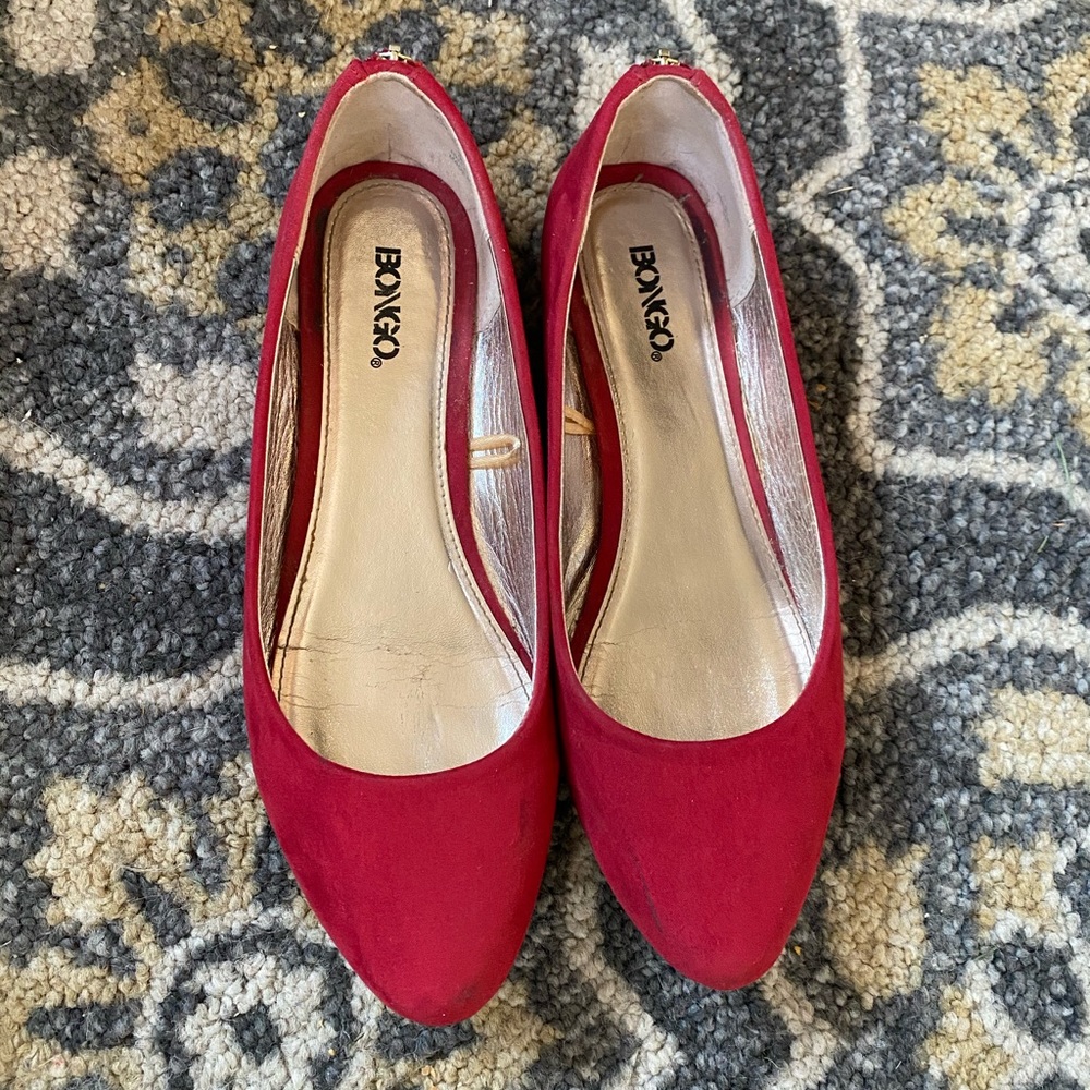 Red suede flats with zipper detail